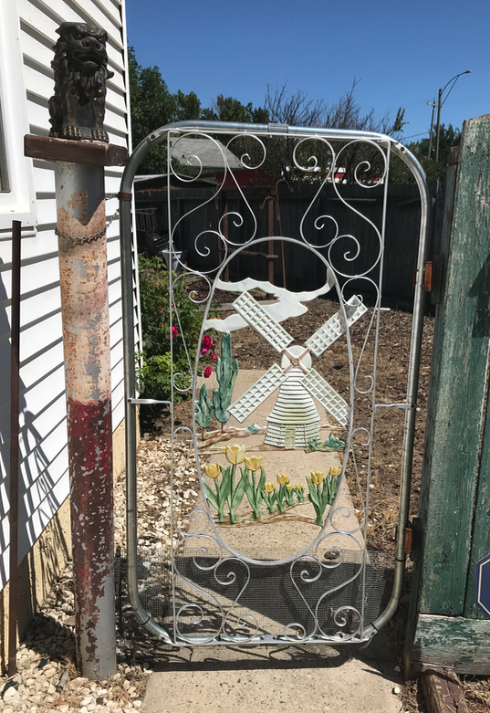 However, we did find this folk art gate. We haven’t seen one like this before.