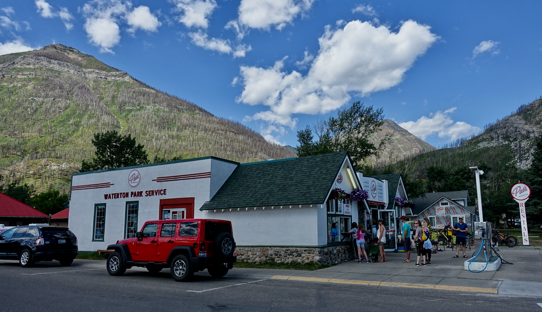 Classic mid century garage today not only serves the needs of vehicles, but also rents bikes and kayaks, as well as being a convenience store.