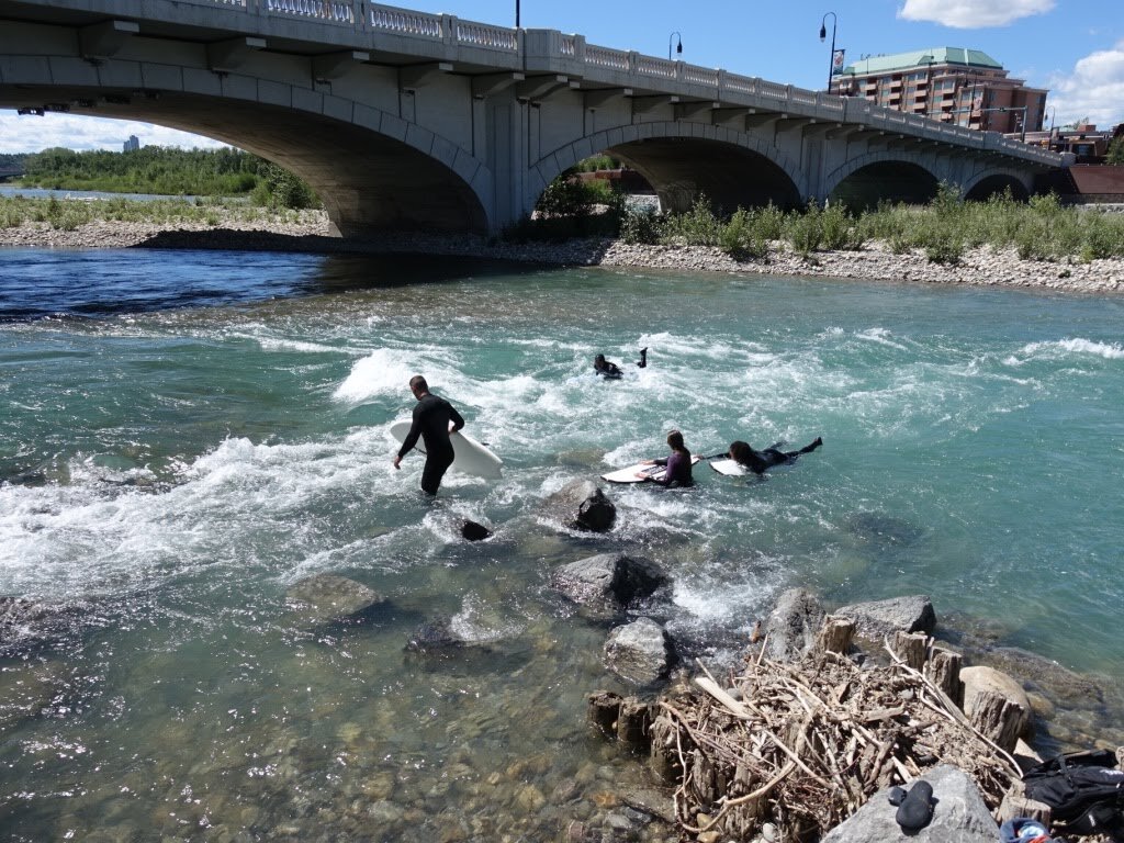 Soon, we you’ll arrive at the historic Louise Bridge built in 1921 and named after Louise Cushing, the daughter of William Henry Cushing, Calgary’s Mayor from 1900 to 1901 (yes, just one year). Under the bridge is The Wave, where the Bow River current creates a natural wave perfect for river surfing. The Alberta River Surfing Association is working with Calgary-based Surf Anywhere to develop the area a world class river surfing park.