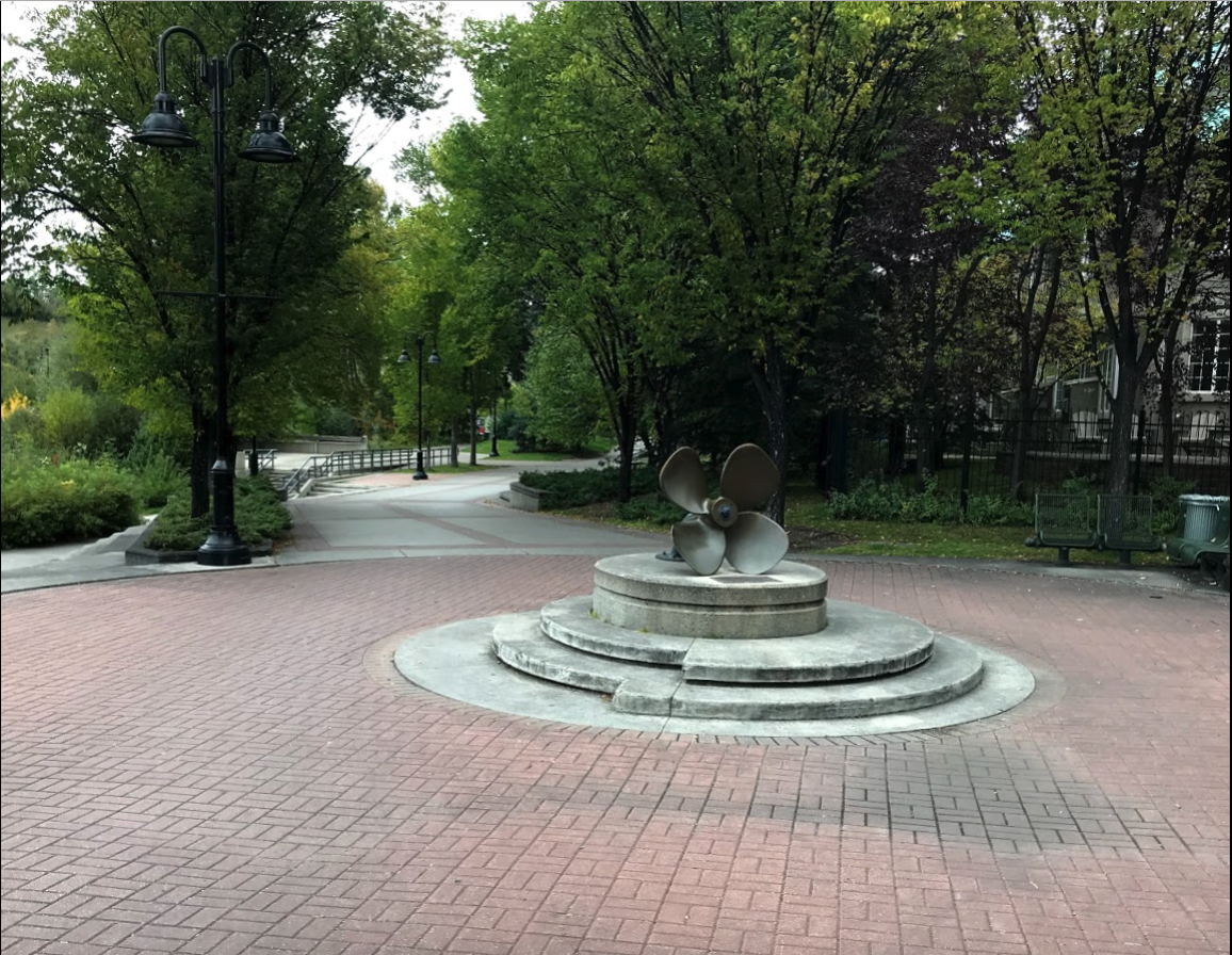 Just a few steps eastward and you encounter a large propeller-like artifact the middle of the pathway. Indeed it is a propeller from a nameless arctic ship. The plaque explains that the propeller which served many years in the Arctic was donated to the City of Calgary by the Society of Naval Architects and Marine Engineers (SNAME) in 1993 to commemorate the fact that Arctic section of SNAME, was started in Calgary in 1980 to support arctic oil and gas exploration.