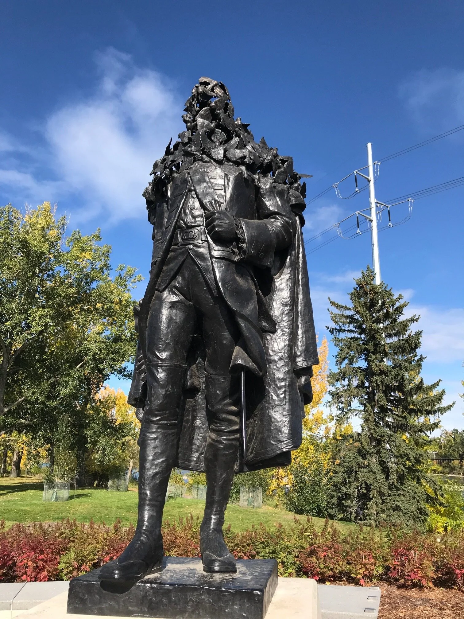 However we are heading east, but not before checking out “The Wolfe and Sparrows” sculpture by Brandon Vickerd, a piece inspired by the 1898 statue of General James Wolfe sculpture by John Massey in Calgary’s Mount Royal community. From a distance, it looks like a typical realistic figurative bronze figure, but get up close to see \ the top of the sculpture is actually a flock of sparrows. The piece was conceived based on many conversations with community members who wanted something historical, yet contemporary. (Ironically General Wolfe never visited Calgary and his fame as the victorious British general in the Plains of Abraham in Quebec City in 1759 has nothing to do with Calgary. In 1759, the confluence of the Bow and Elbow River was a temporary summer meeting place for local First Nations.)
