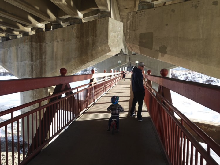 Keep going east and you will walk under the Crowchild Trail bridge where you will find the charming Dave Freeze pedestrian bridge.