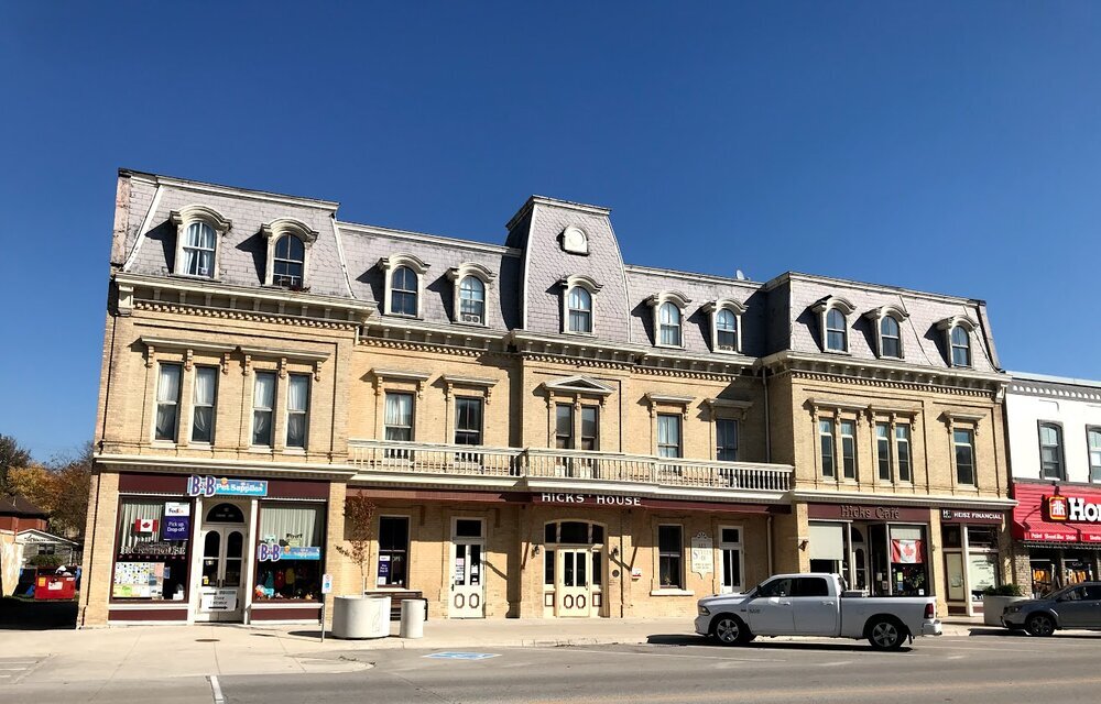 Hicks House built in the 1870s as a hotel, now has commercial uses on the main floor and residential above.