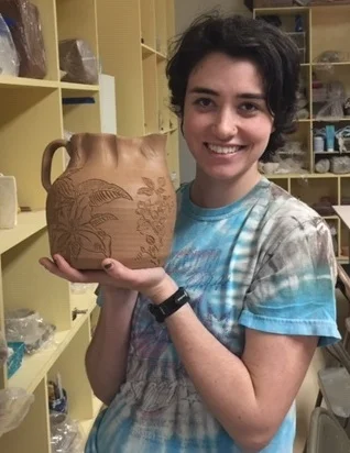 Aubree Van Winkle Hey everyone! I’m Aubree, and I’m from a small town located in the foothills of the Northeast Georgia mountains. This background really influences where I find my inspiration, namely local flora and mountain scenes! I love making functional but beautiful pieces of pottery, because I like the idea of my art being used and not just being looked at. I enjoy drawing with charcoal when not drawing on clay, which is actually where I got the idea to start drawing on clay in the first place. Other passions include listening to and playing music, throwing around a frisbee, hiking, and old Volkswagens. Find more of Aubree’s work: https://www.instagram.com/aubreevwpottery/
