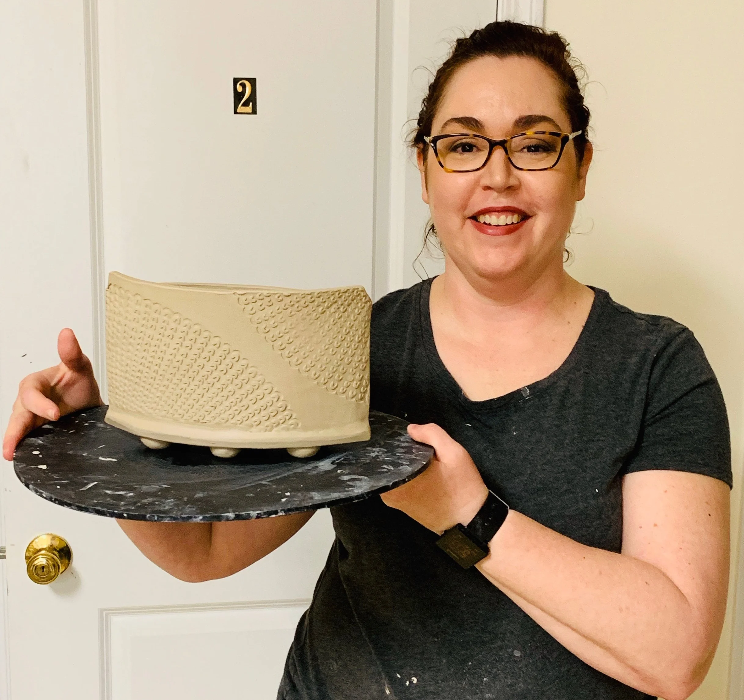Stephanie Johnson My love affair with ceramics started about 15 years ago. I watched a potter throw on the wheel and instantly knew that I wanted to learn the art form. Over the years I've learned the tricks of the trade from classes at Good Dirt, and now am teaching the handbuilding Try Clay class on Sunday afternoons. Whether painting designs on mugs or creating intricate patterns on slabs of clay and using them to hand build forms, my focus tends to be on surface decoration. I really enjoy making functional forms and then decorating them to add a little flair.