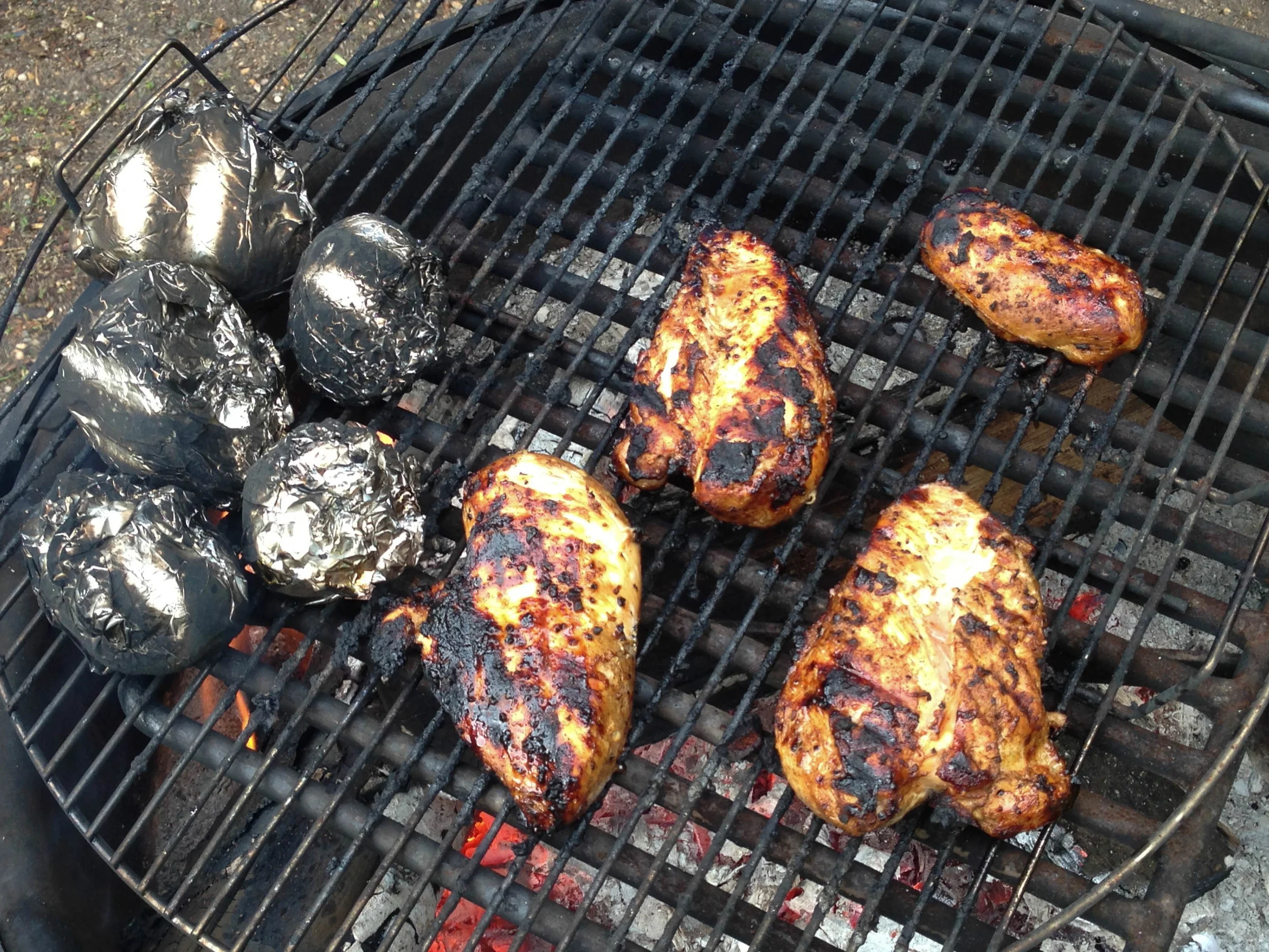 Cooking the chicken and baked potatoes