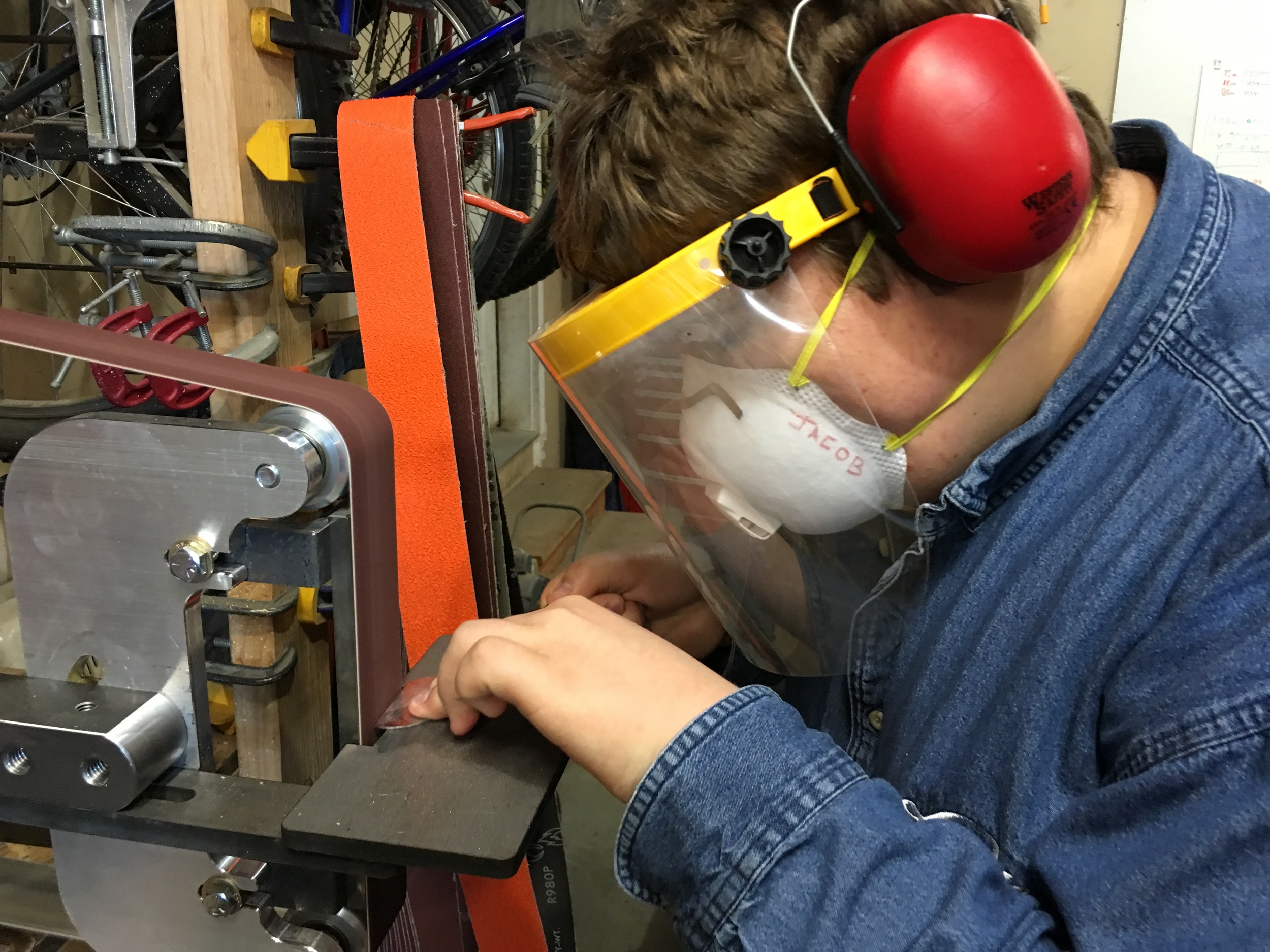 Jacob working on some primitive metal arrowheads for a bow project