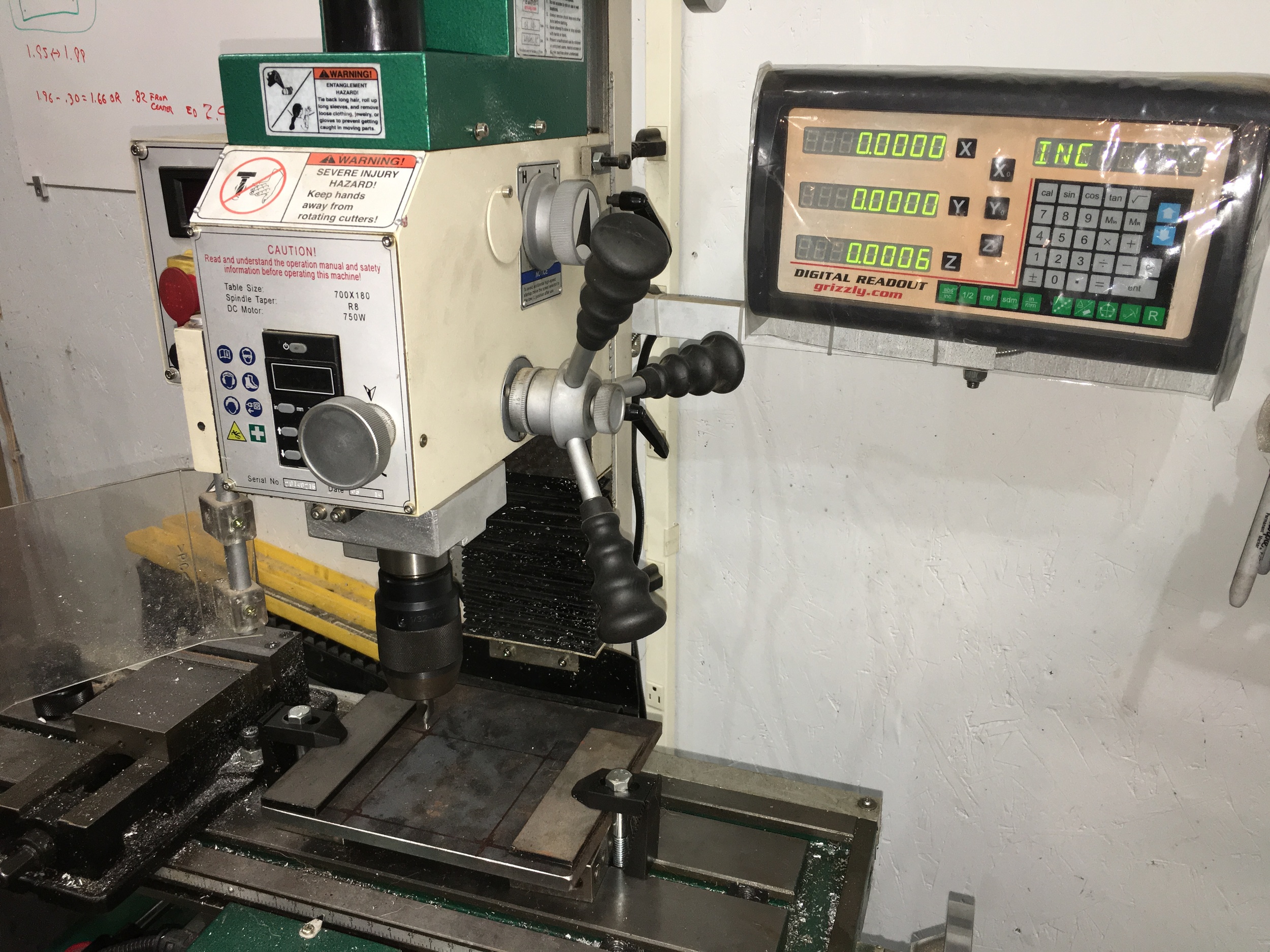 A steel plate setup on the vertical mill to be drilled out for a project