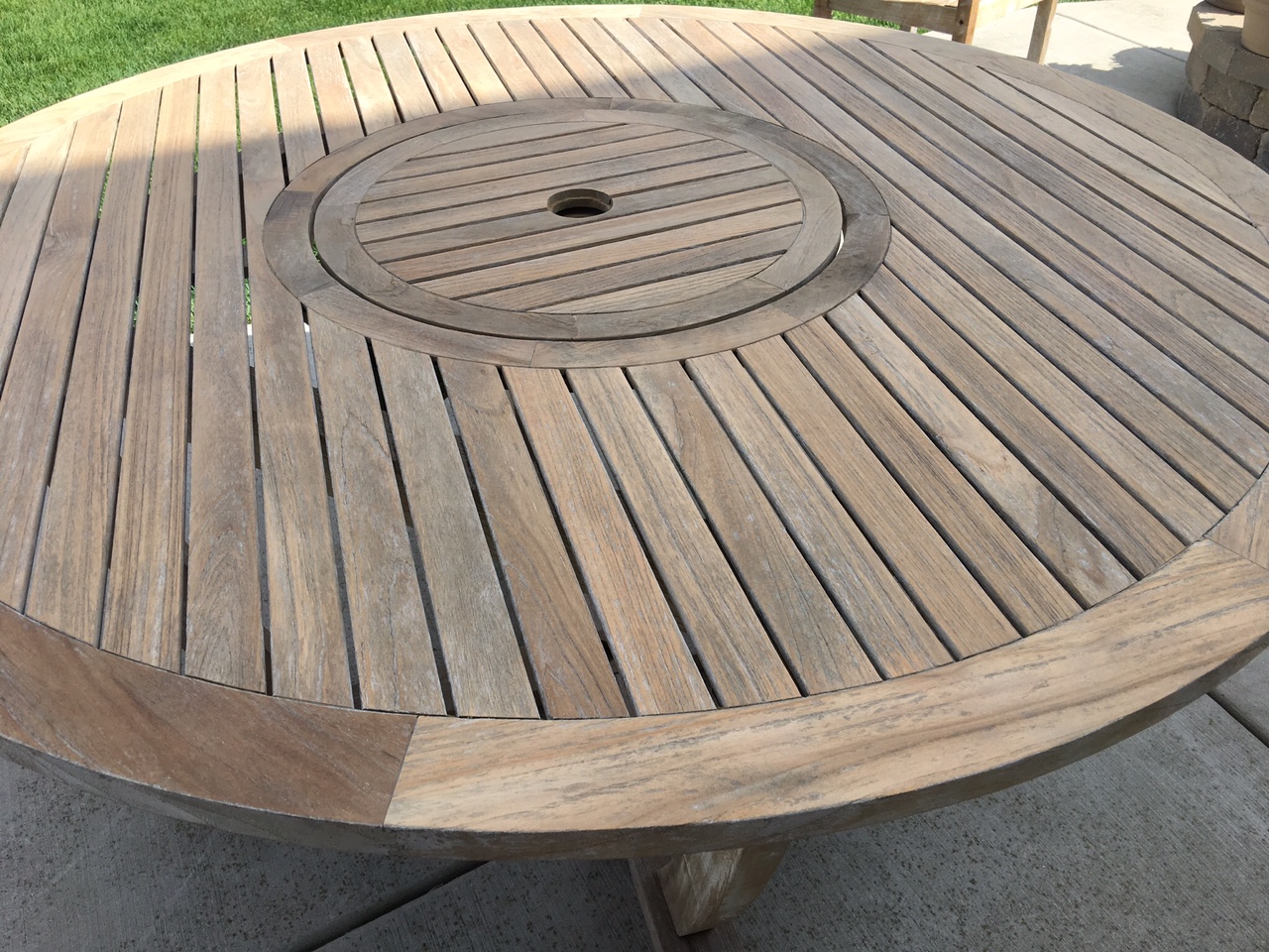 I sanded the table top and visible parts of the legs to remove the cloudy buildup from the last varnish. You can see the varnish buildup on the leg in this photo. It took some work but did eventually sand out.