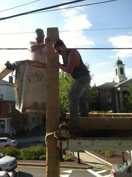 Looking out from the living room window. The posts being positioned.