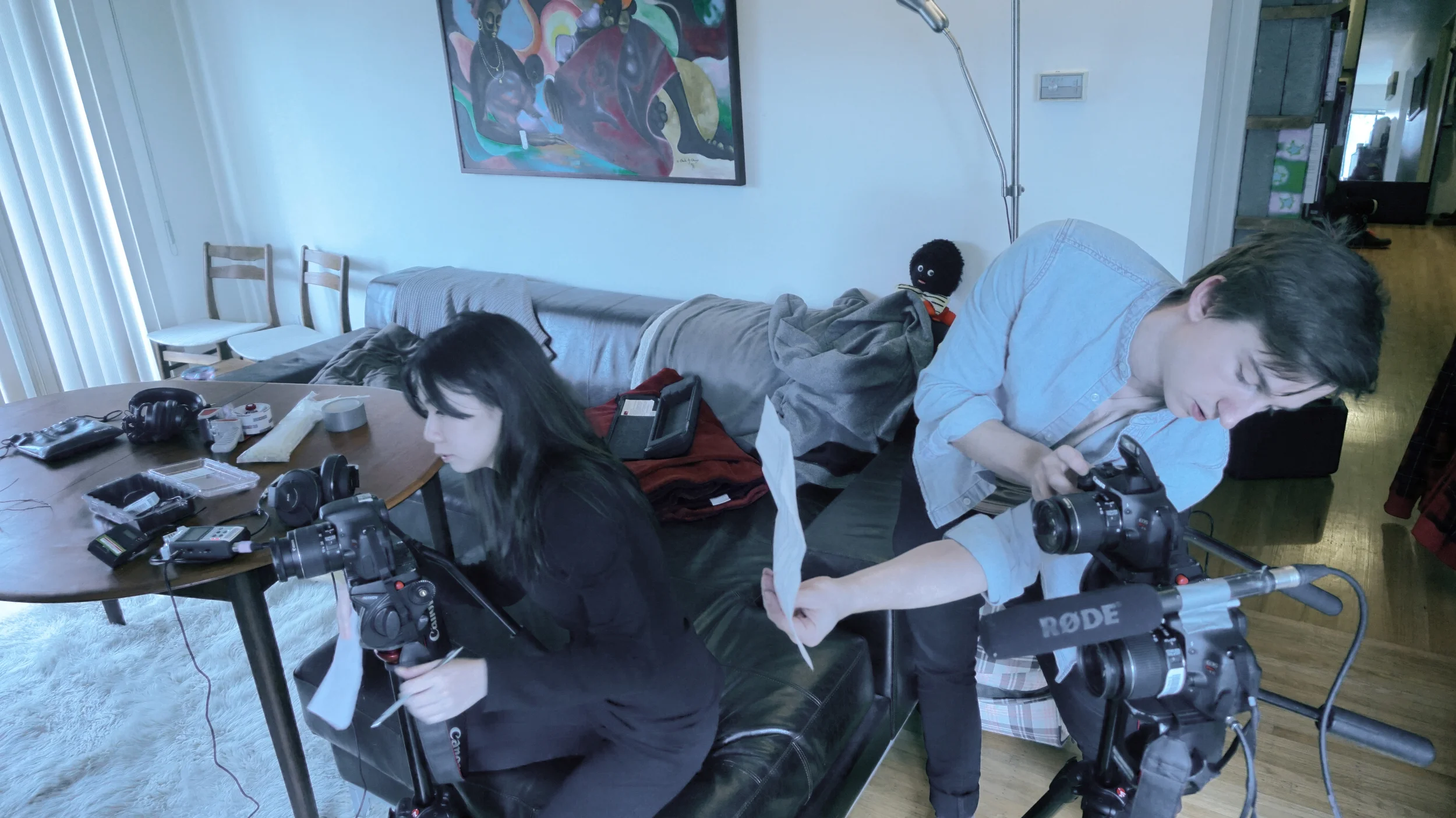 Setting up the cameras and checking the sound equipment.