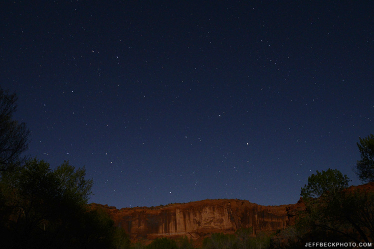 Moonlight illuminates the canyon wall from my camp beside the Escalante River.