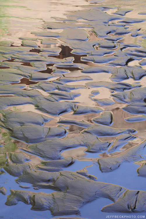 Mud ripples frame reflections in Harris Wash.