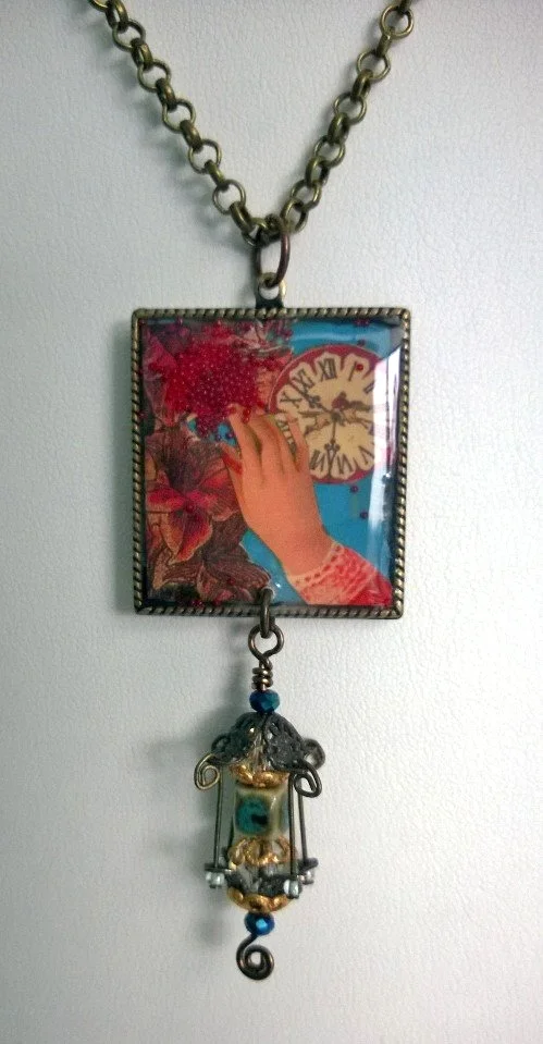 Resin collage focal with beaded lantern tassel.