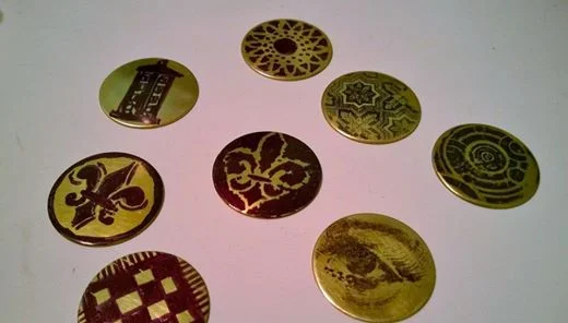The next step was to find designs to etch. I tried three different types to test how each would work. The dark bits of the image act as a resist to the etching solution, so the brass parts exposed will be slightly eaten away leaving a raised image. 