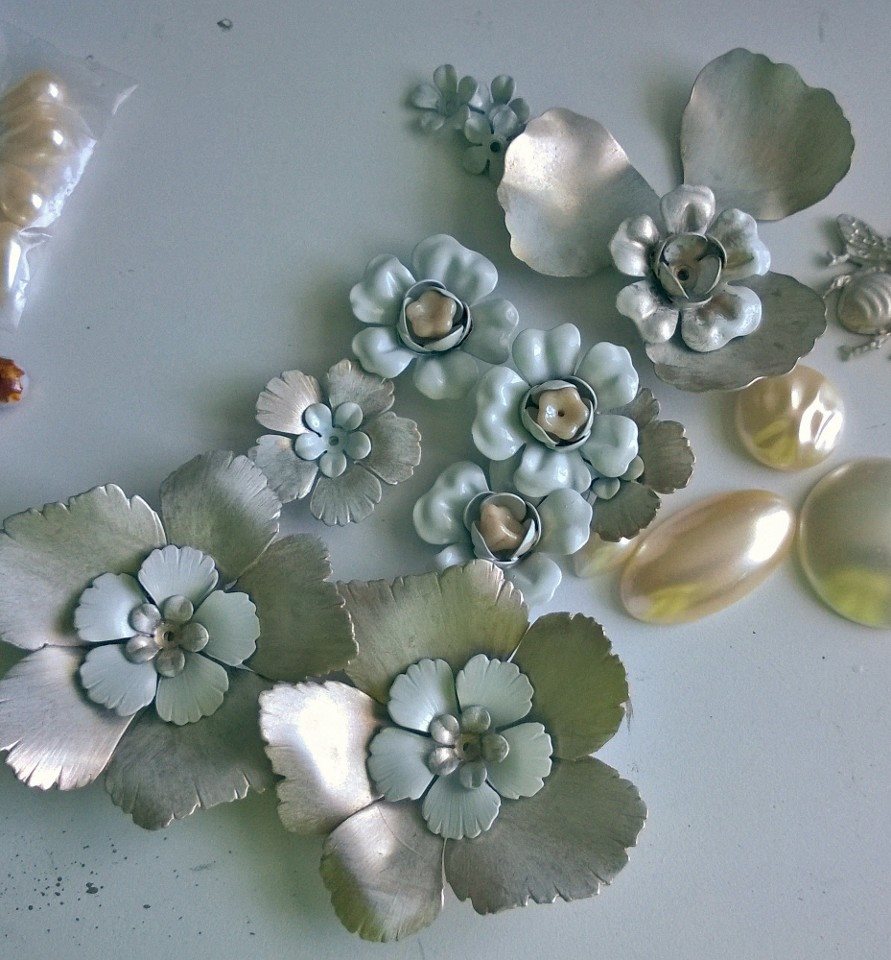 My original thought was to use Czech glass bell flowers and pearl cabochons. I edited a bit once my final design came together.