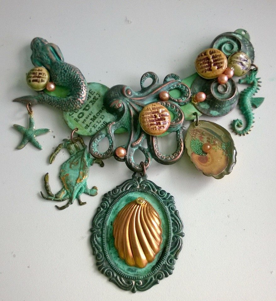 Cabochons and pearls are added