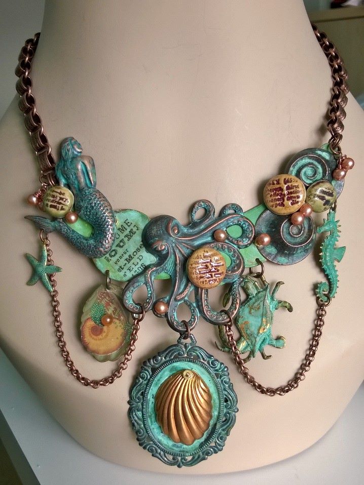 Final piece. I added bookchain and decided against using any other bead other than the bronze pearls dotted around and attached at the ends. Festooned rolo chain completes the look. I'm really proud of this one.