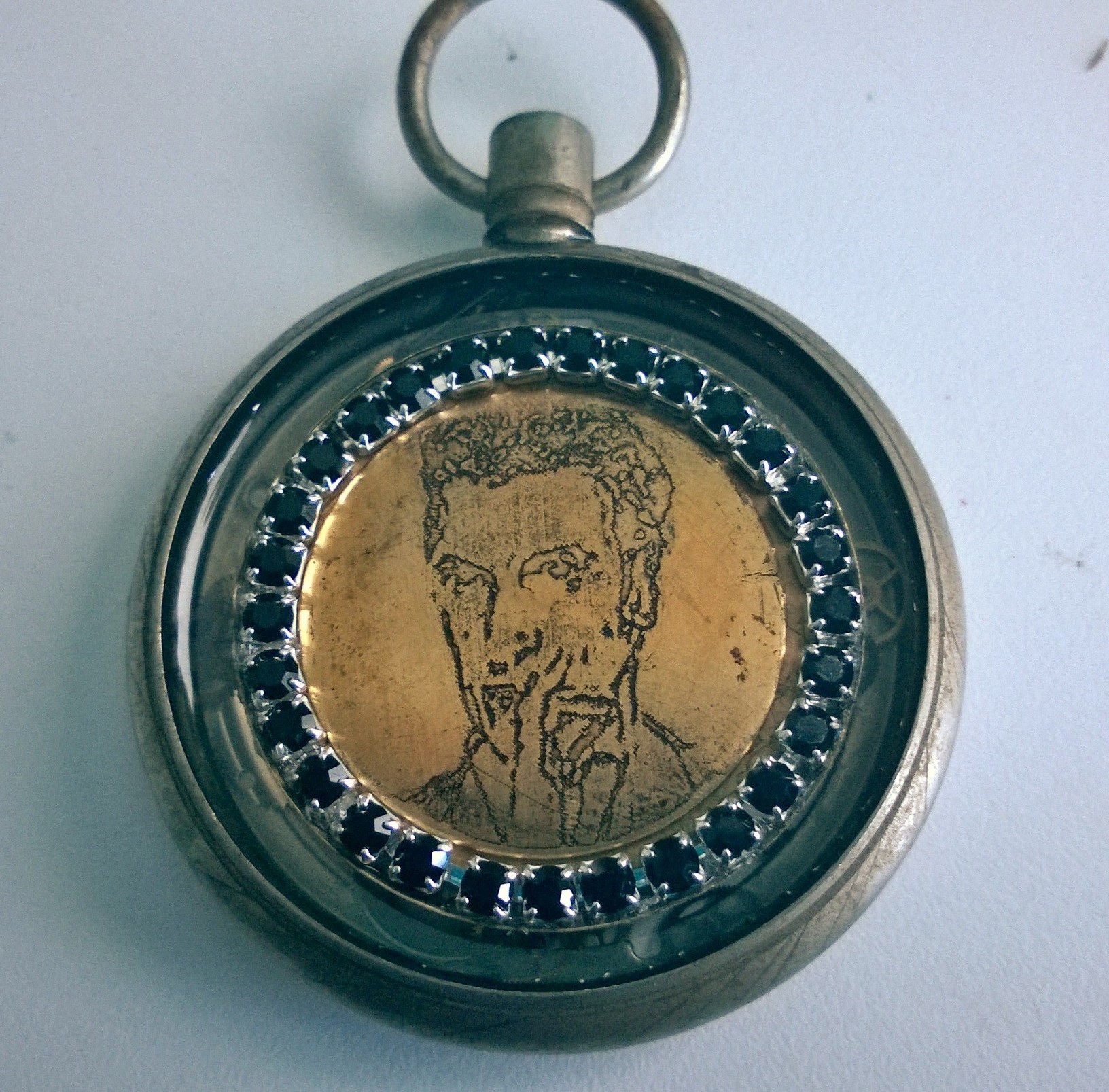 Reverse side - Twelve etching surrounded by Czech black faceted stones suspended in resin