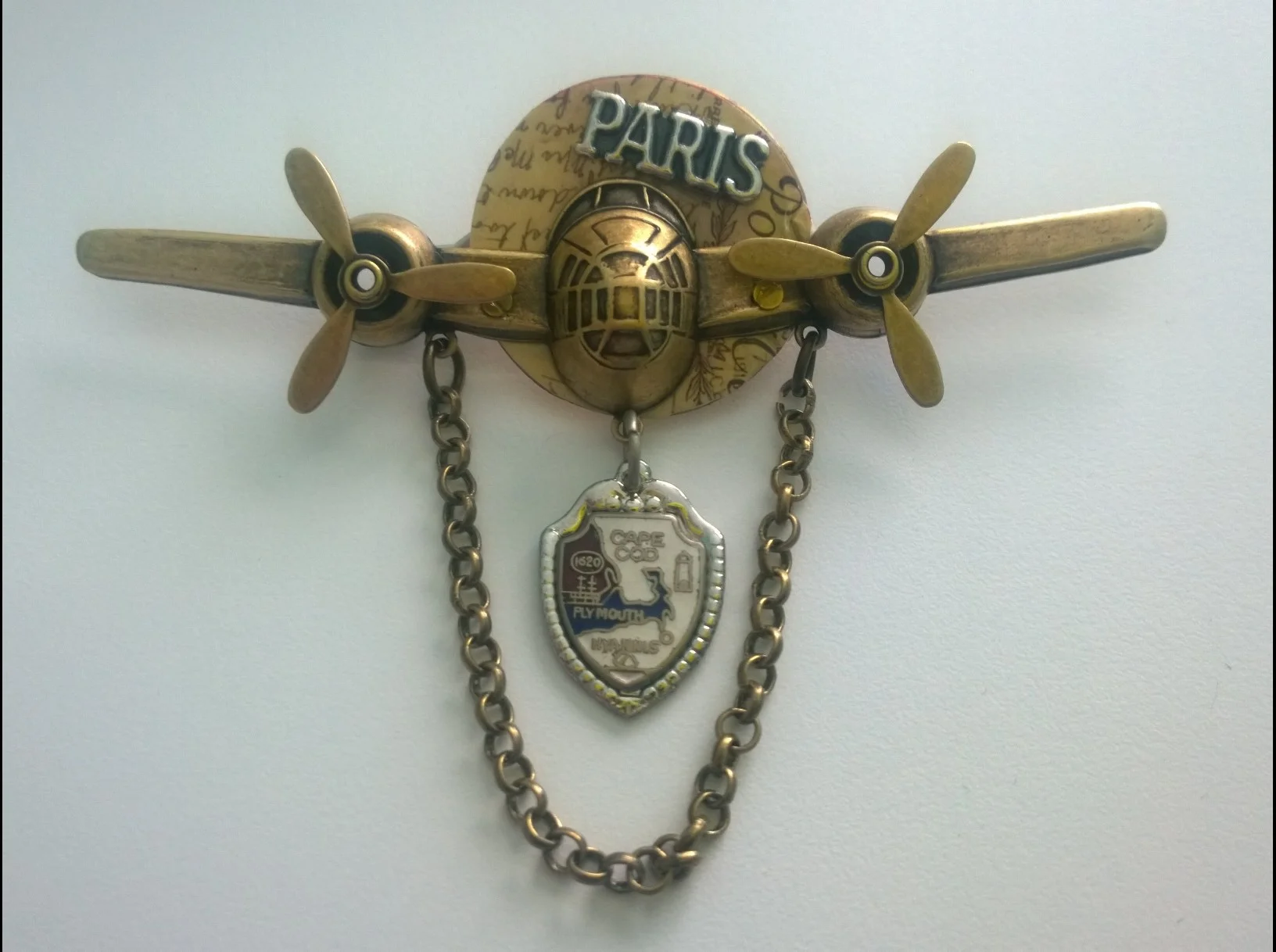 Prototype Travel pin design with souvenir spoon accent.