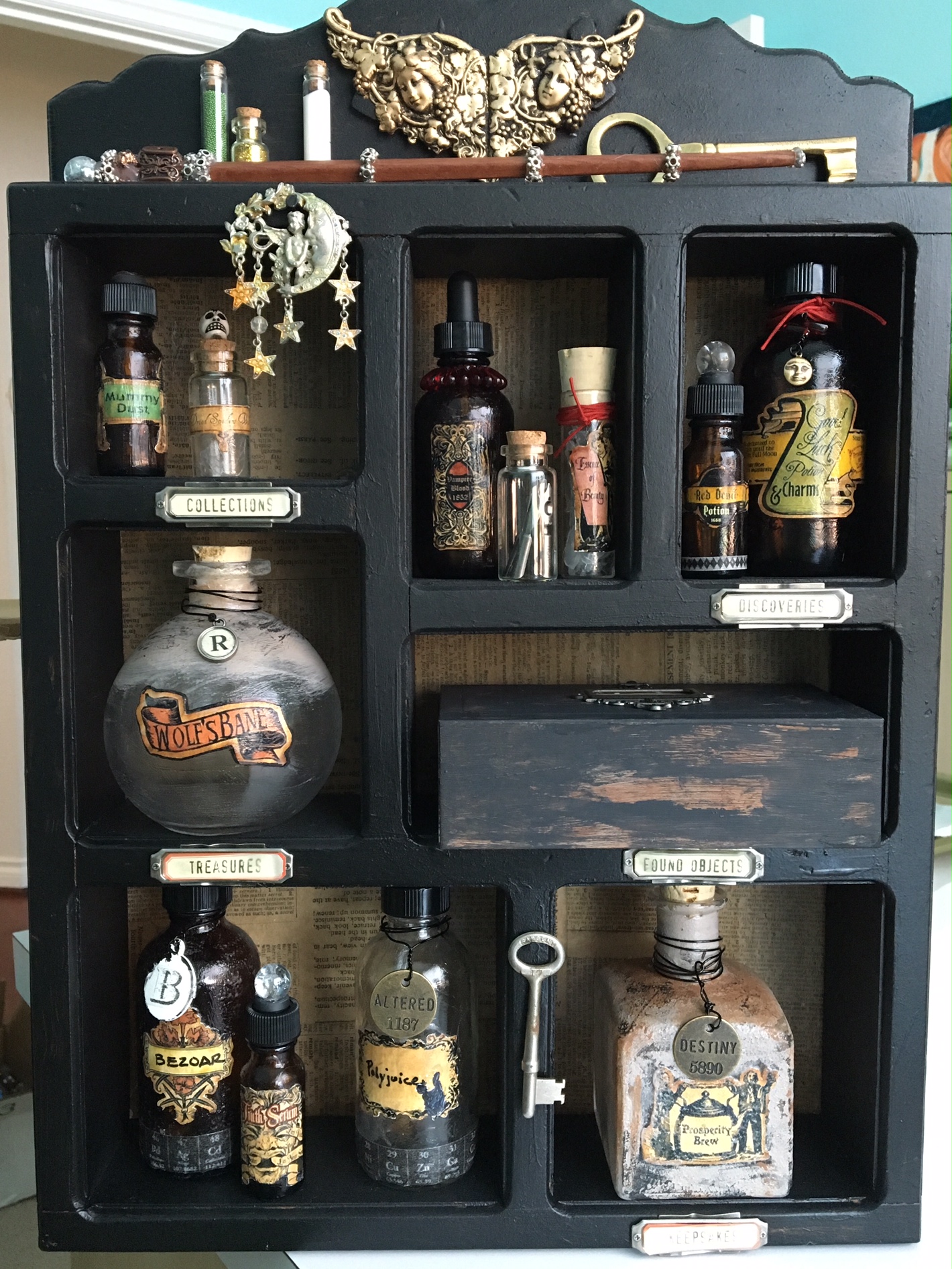 So there you have it! An apothecary fit for Severus Snape! I did some final touches on the bottles, added caps, cracked marbles and more embellishments on some of the smaller bottles. I'm really pleased with how this turned out and I can't wait to use it for the party!