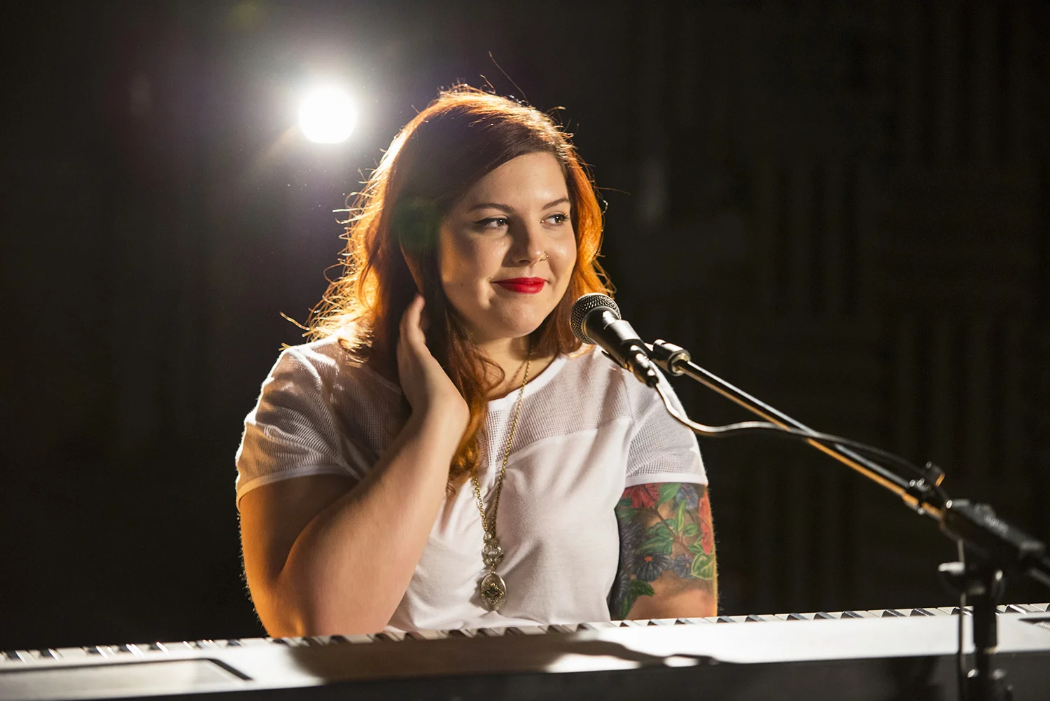 Mary Lambert, performing at the Billboard Studio