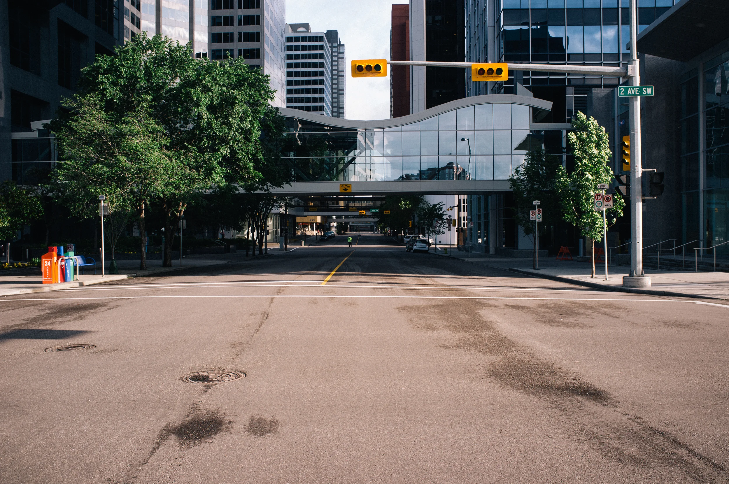 Directing traffic. What little there was. Many of the traffic lights are out downtown, along with the power—cut after evacuation. 2 Avenue SW at 4 Street SW.
