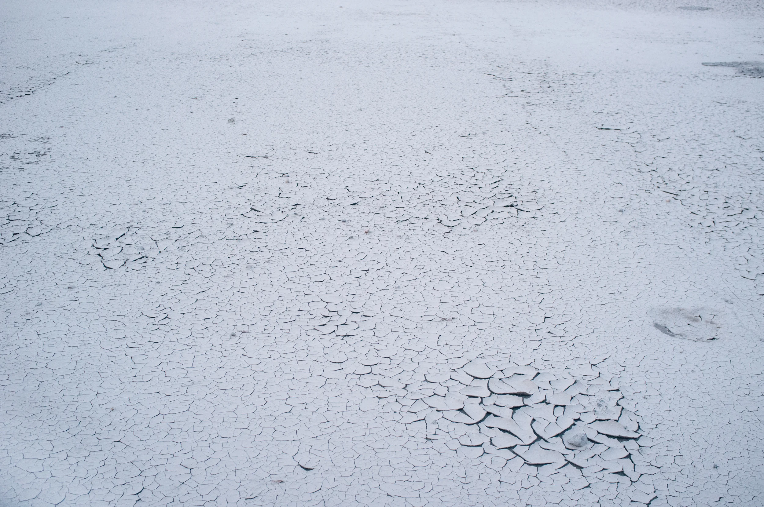 Silt remains in the Calgary Police Association parking lot.