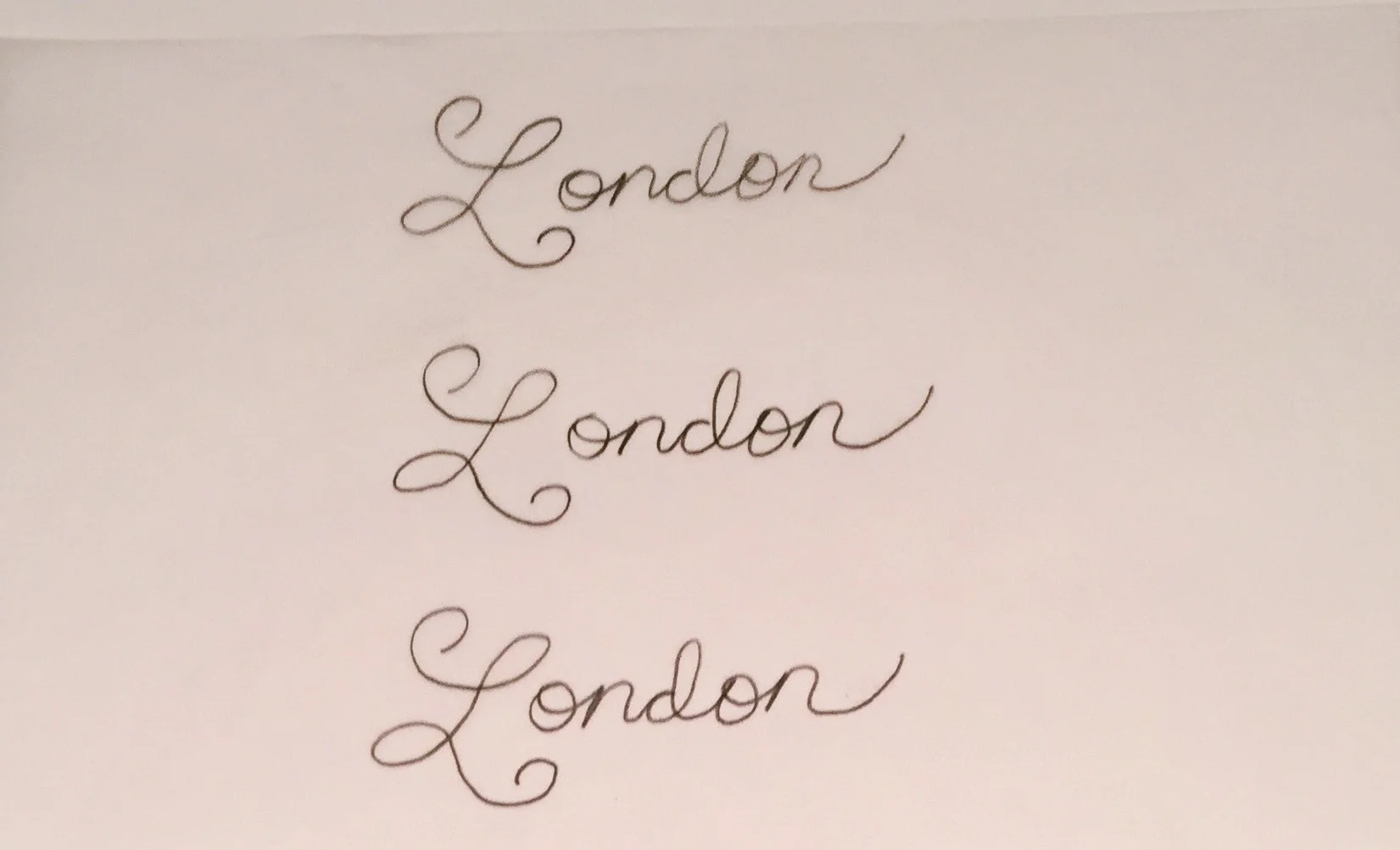 The lettering process begins with sketching out some ideas for the lettering on paper.