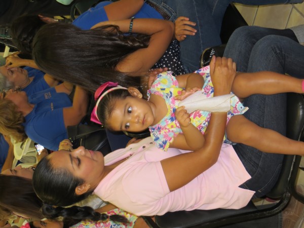 Wife and daughter of bombero con new uniform.jpg