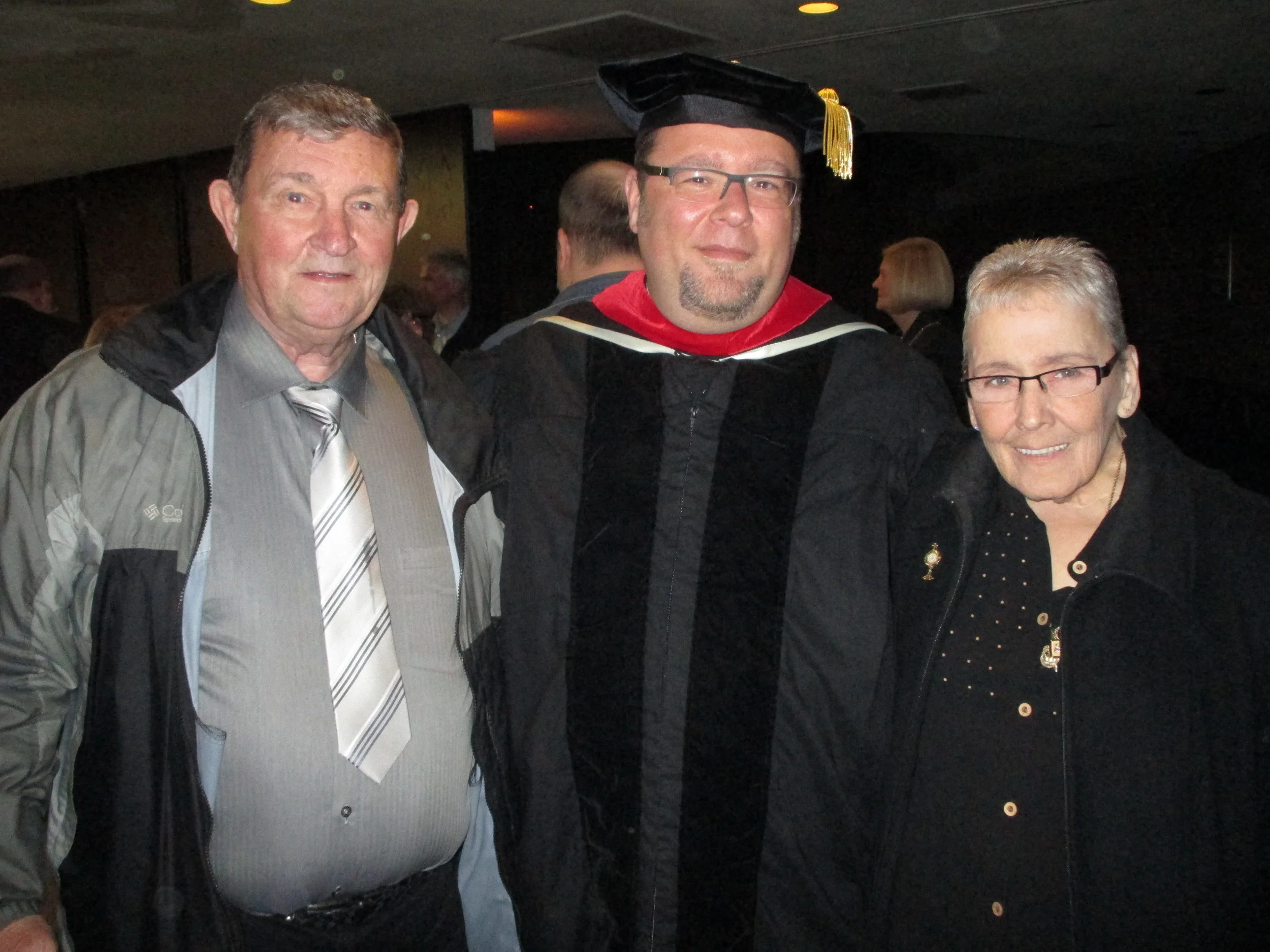 Rev. Rich Young, O.S.A., D.Min., pictured with parents Rich & Barb Young, was awarded his doctorate from Catholic Theological Union on May 15, 2014