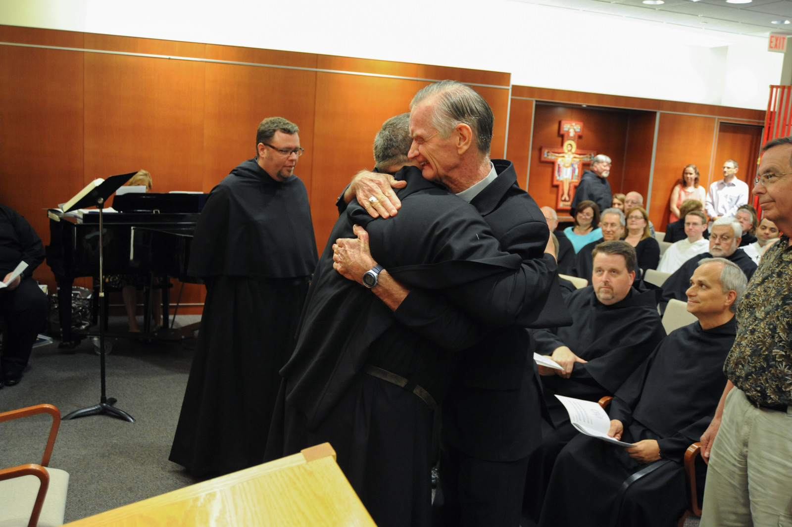 Bishop Dan Turley, O.S.A., congratulates Fr. Bernie Scianna, O.S.A., on his second term as Prior Provincial