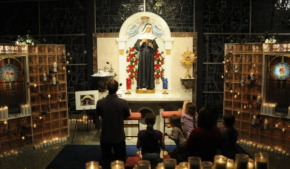 CHICAGO, IL: Guests praying at the Shrine to Saint Rita of Cascia