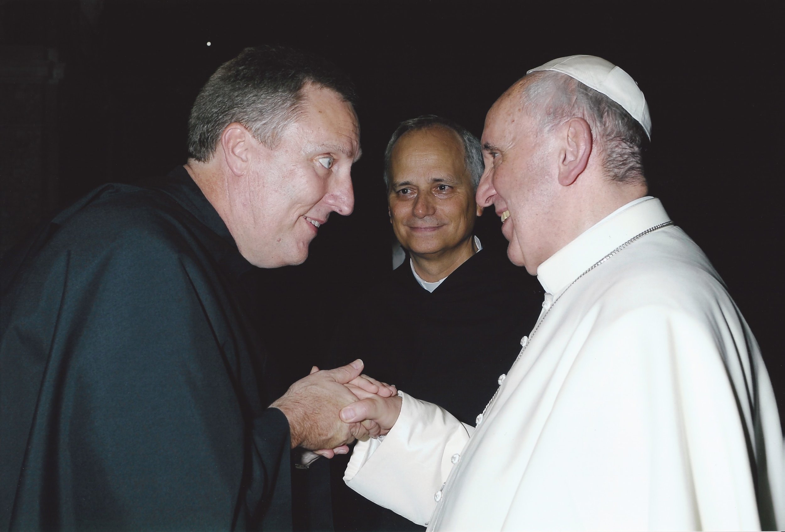 His family was once concerned they would not have enough money to send him to the seminary. Father John Merkelis, O.S.A., is now a beloved friar, seen here meeting Pope Francis. © 2013 Servizio Fotografico, Citiá del Vaticano