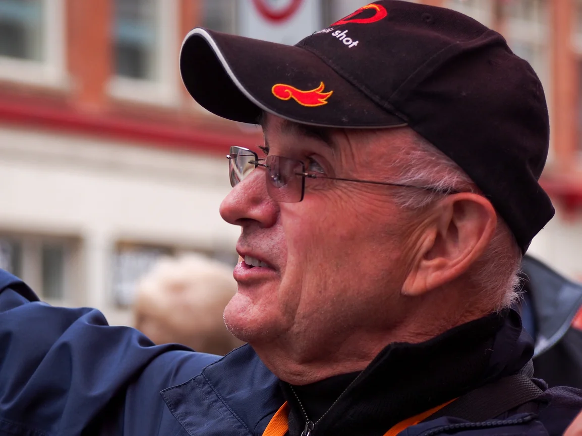 In front of the Calgary Herald Block, literary historian George Melnyk recounts the story of Chief Buffalo Child Long Lance, who worked as a reporter at the Herald in the 1920s. Claiming to be the son of a Blackfoot chief, Long Lance was later exposed and nicknamed "The Glorious Imposter." Photo: Leo Aragon