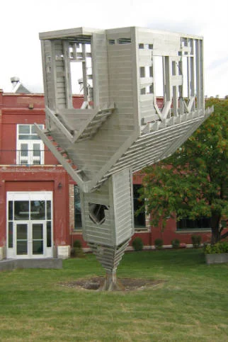 Dennis Oppenheim's " Device to Root Out Evil " was installed in Ramsay, a few blocks away from the murder site in Susan Calder's novel. The sculpture became a landmark during its stay in Calgary between 2008 and 2014. (Photo: Calgary Public Library, Judith Umbach Photograph Collection ) 