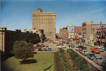 Looking west to the Palliser Hotel, also known as the Castle by the Tracks, in what looks to be the 1950s. The old Calgary railway station is in the left foreground and Ninth Avenue is on the right. (Photo: Calgary Public Library )