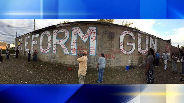 Kyle Holbrook uses art as a tool to bring change, this is the “Reform Gun” (Laws, awareness, use, violence) after another mass shooting this mural was to bring awareness to the constant violence in inner cities everyday.