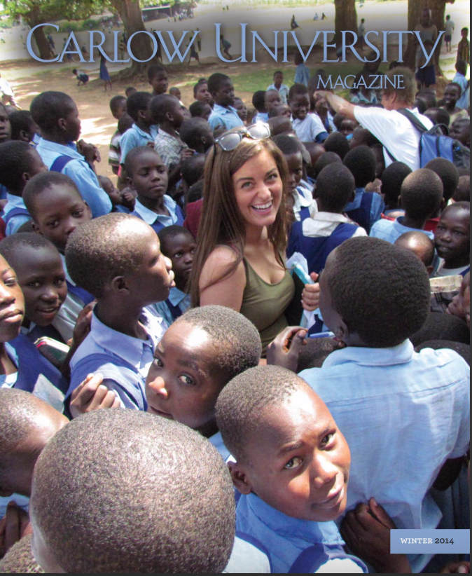 Emily Atheson with youth from one of the eight orphanages visited, she was instrumental in assisting Kyle Holbrook in several murals throughout Uganda with youth many of whom had mental and or physical disabilities.