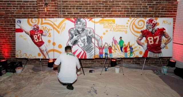 Live Mural in progress at this fashionable charity Event. Kyle said “ Travis talks with this kids like an older cousin or something, the entire 87 and Running team are genuine good people, its really great how they involve several players with the community.”