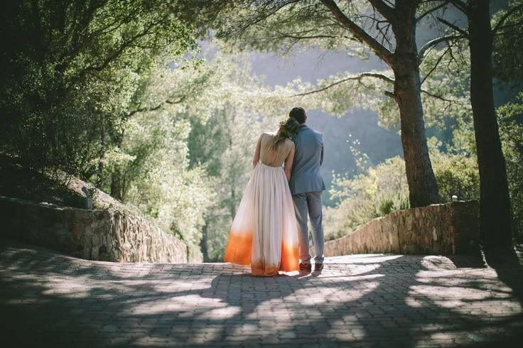 bride and groom outdoors from the back