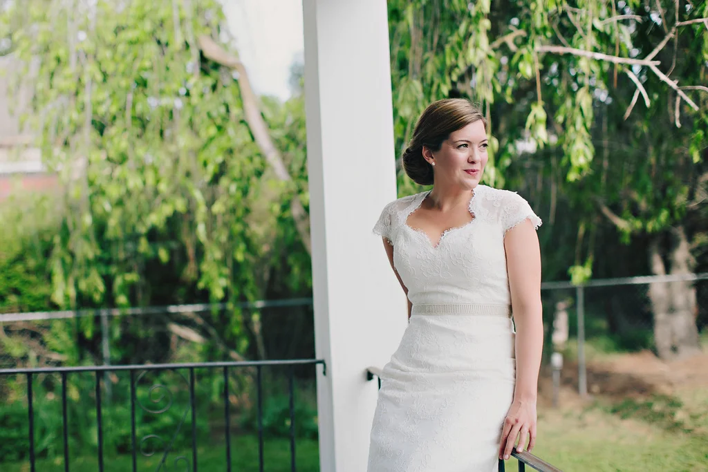 Wedding sash by Winifred Bean complimenting this lace keyhole back wedding dress