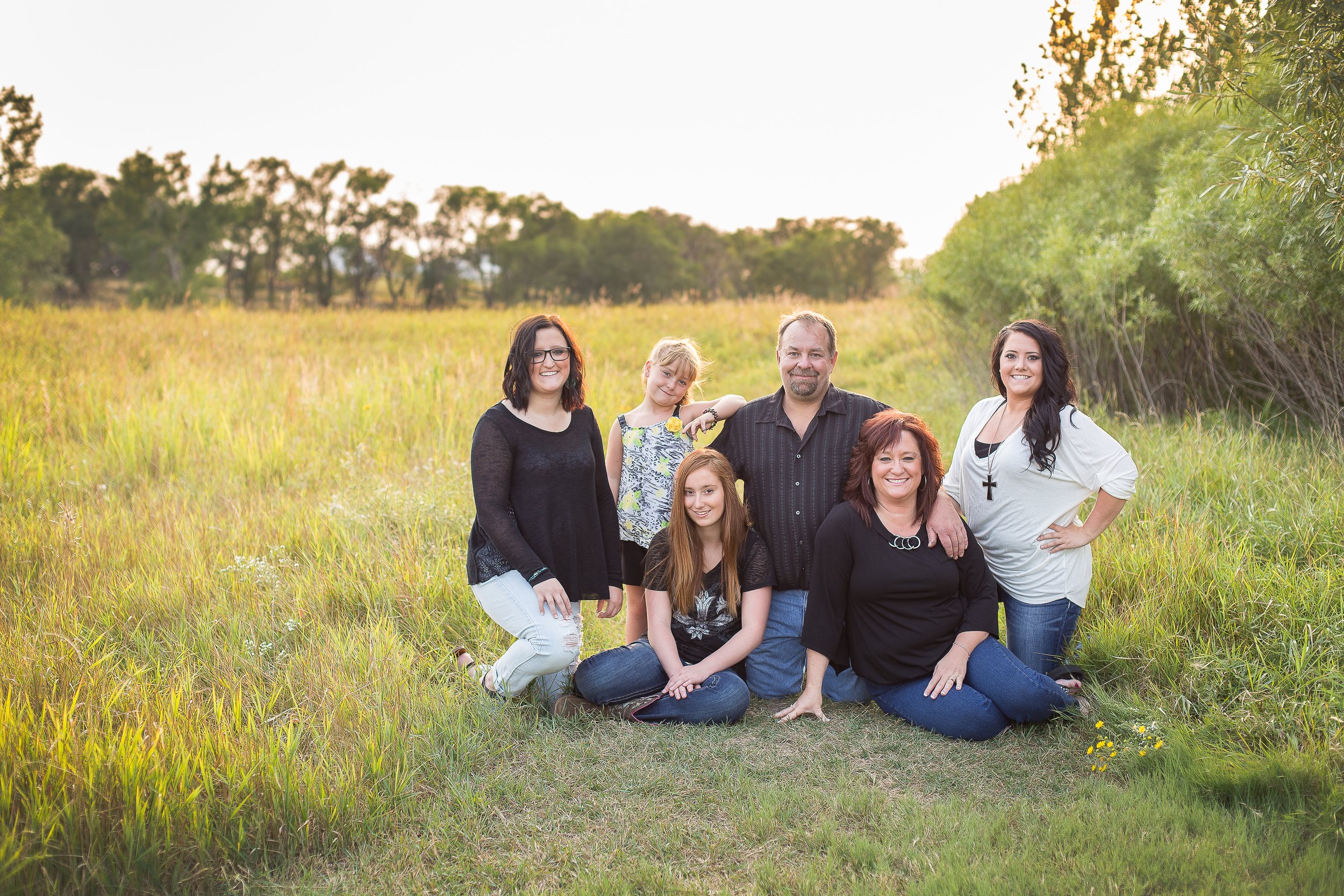 Shelby did an amazing job! She was fun and so flexible. She even got my husband to smile. That in its self is an amazing job! She made everyone feel very comfortable and relaxed. I couldn't asked for better pictures of our family of 6! I I will be recommending Shelby to all my friends and family or anyone that wants a fun, spunky and comfortable photo shoot. SHELBY'S FANTASTIC!! She definitely gave us what we asked for. ---Shawn M.