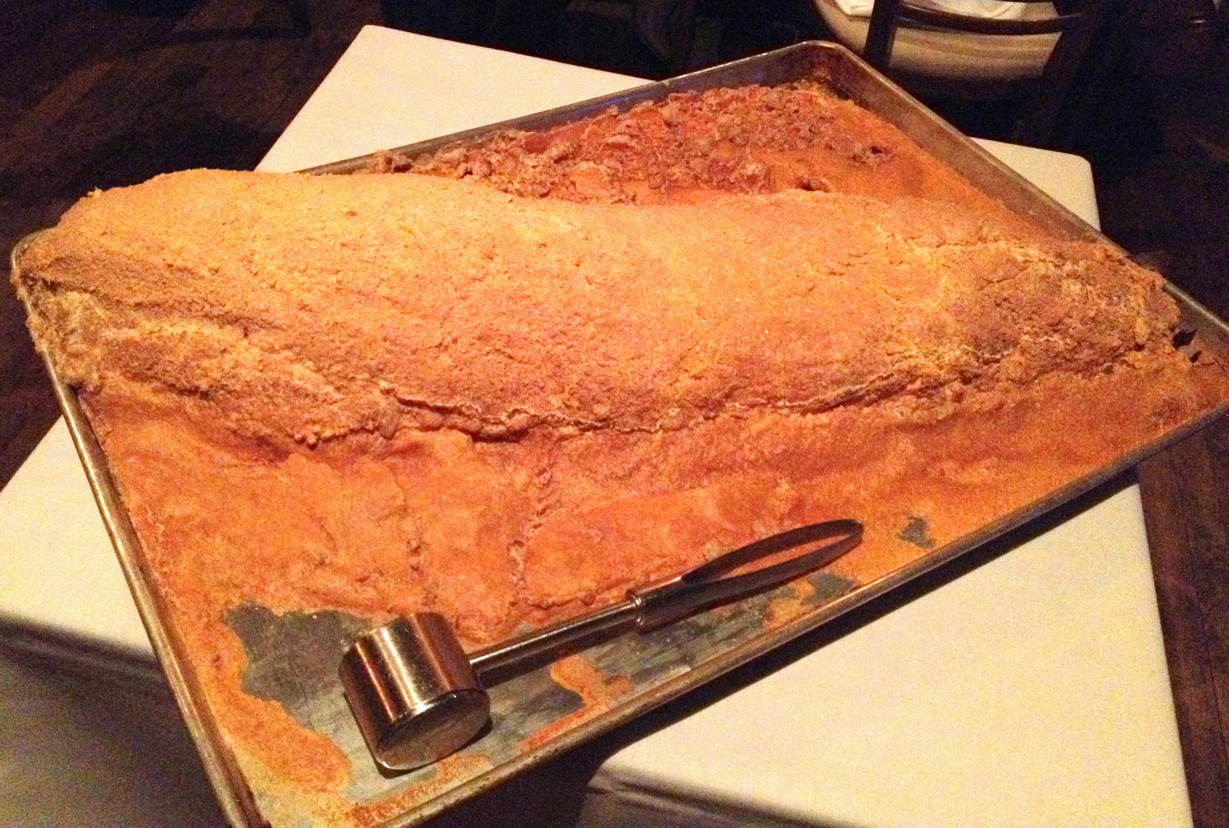 Third course: a whole salt-encrusted striped bass