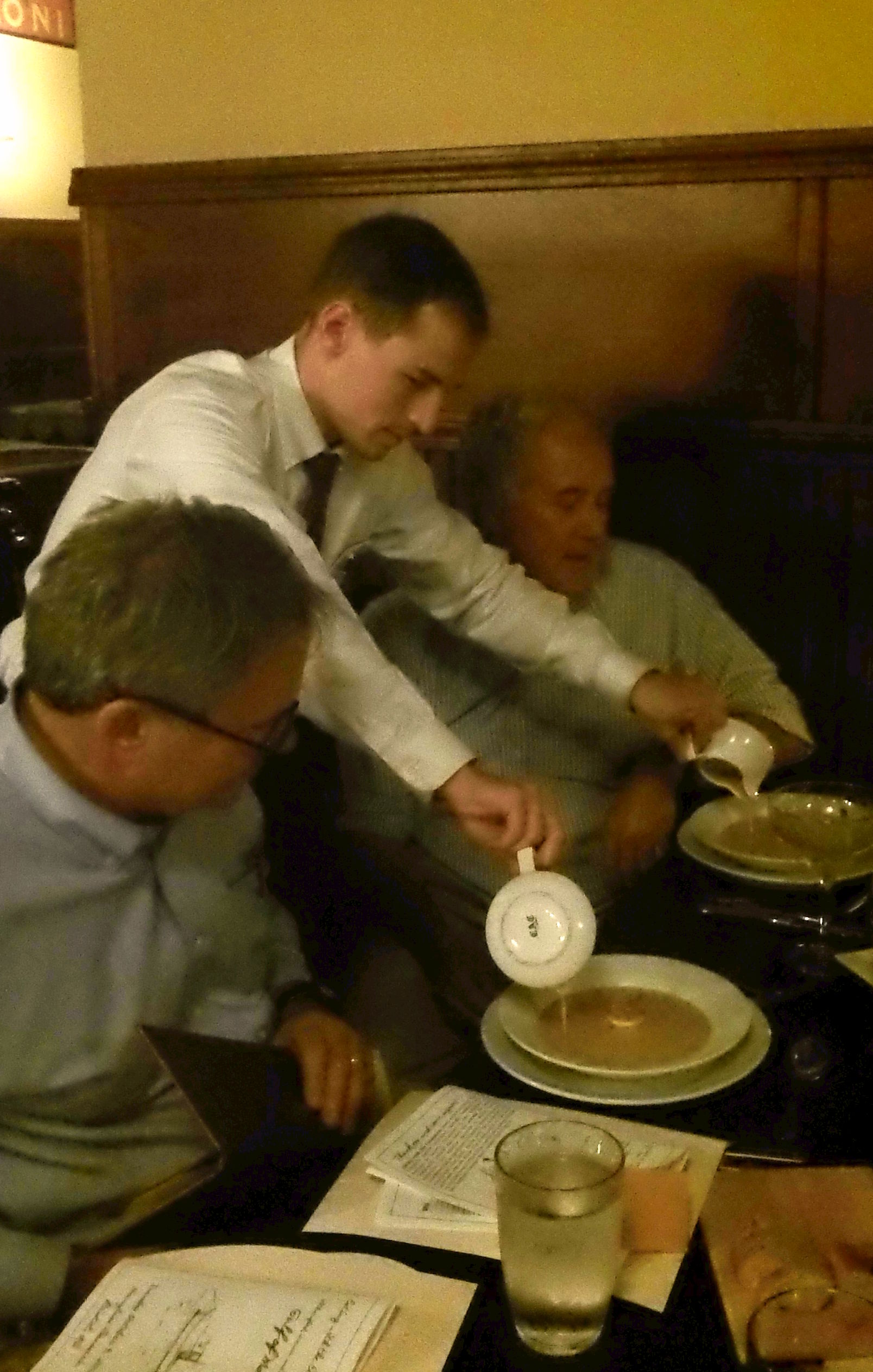 Server pours the bisque