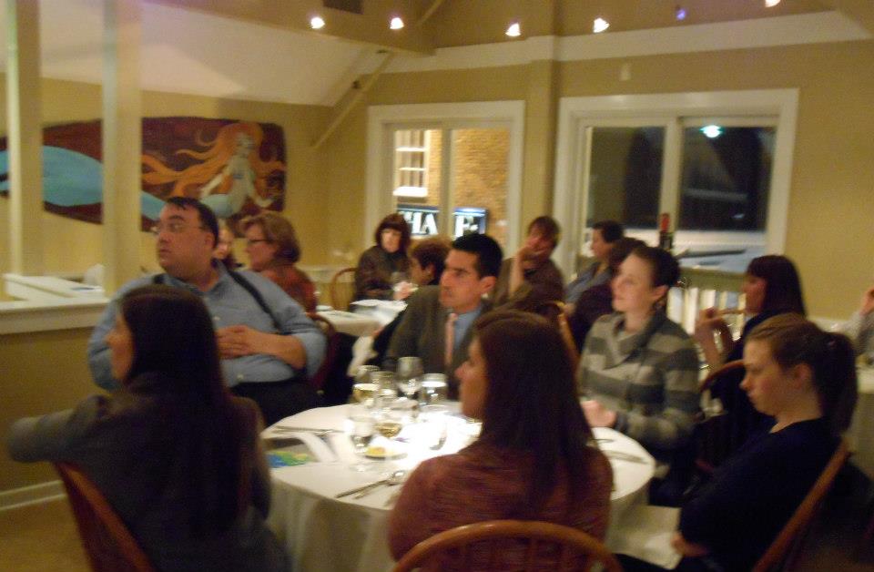 Guests listen intently as Kim Hyde explains a shift in the average size of phytoplankton in the Gulf of Maine.