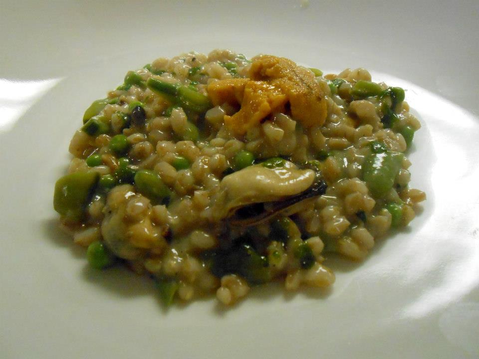 Third course: Seafood farrotto, with mussels, mahogany clams, sea urchin, spring peas, and sorrel oil.