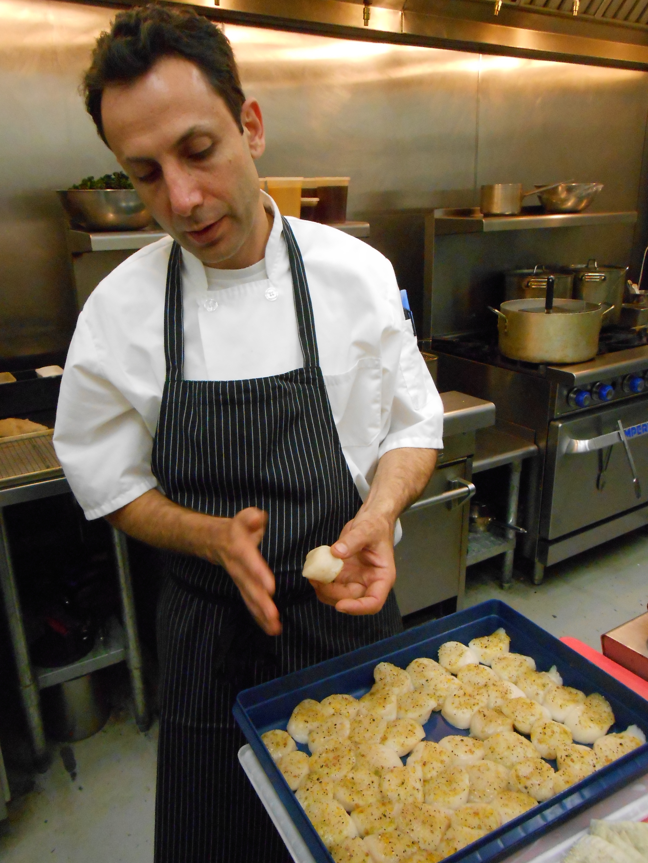 Chez Riz inspects the scallops