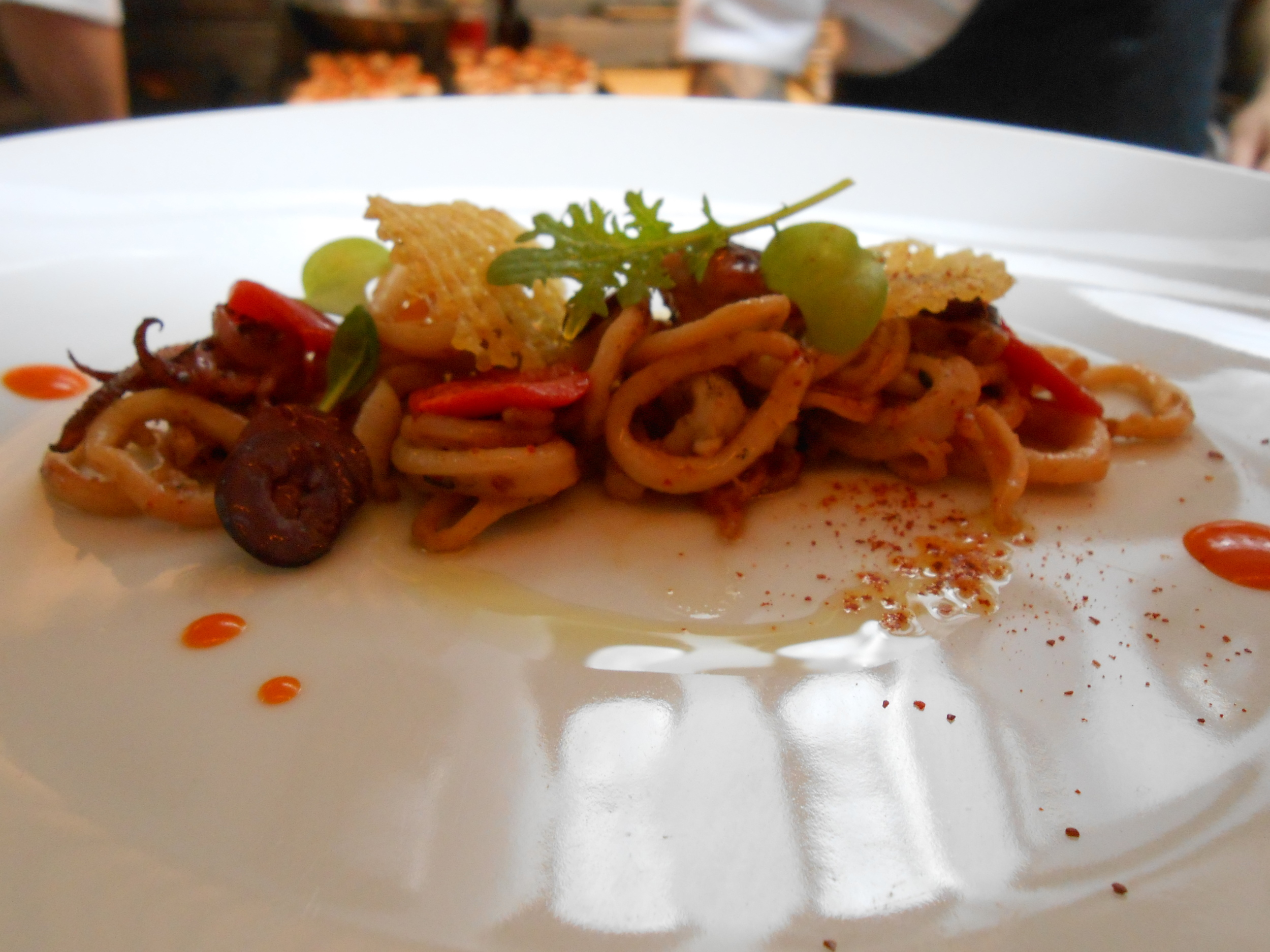 First course: Squid with piquillo, radish, and lemon confit