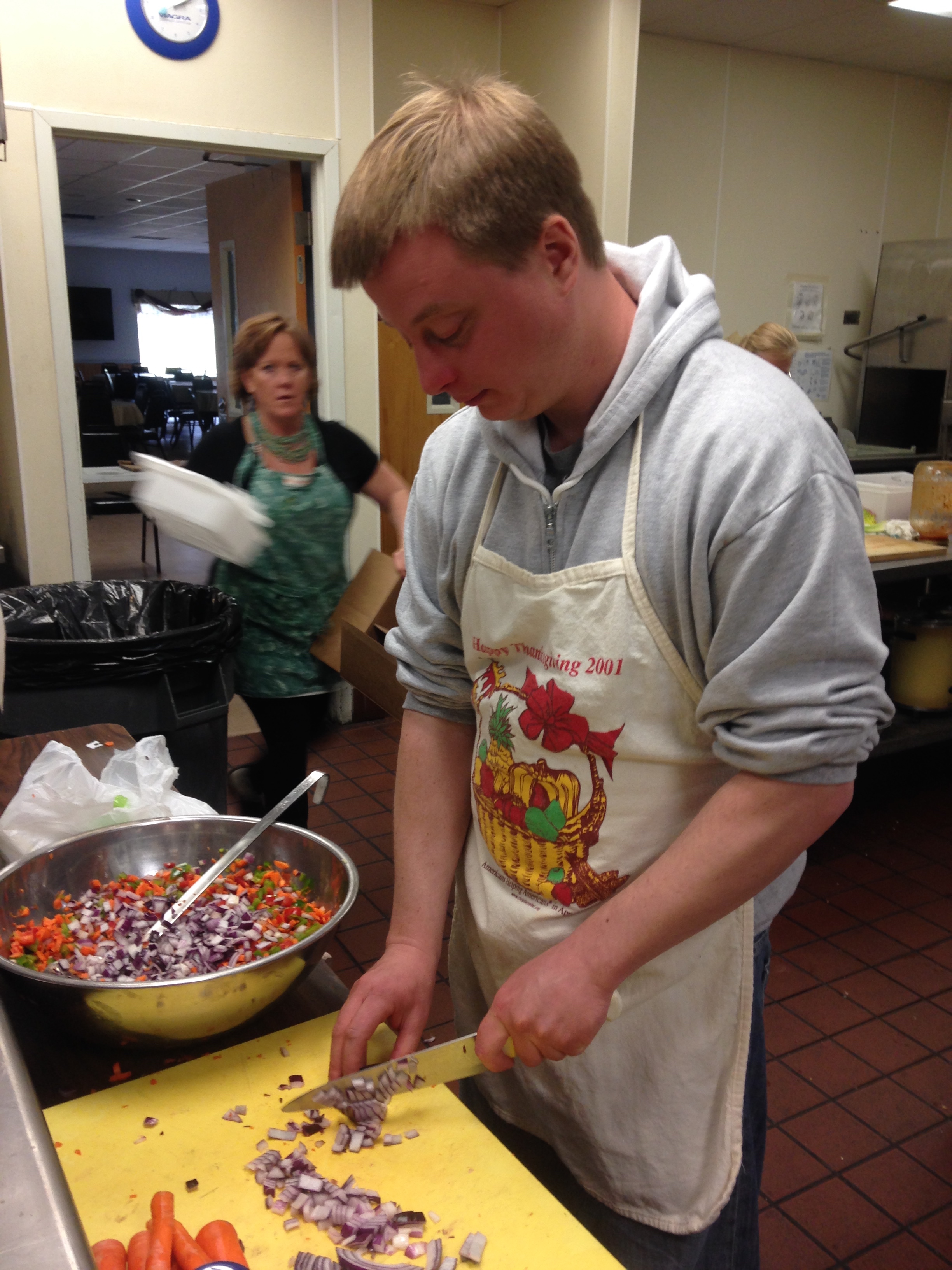 Miles chops veggies for the risotto